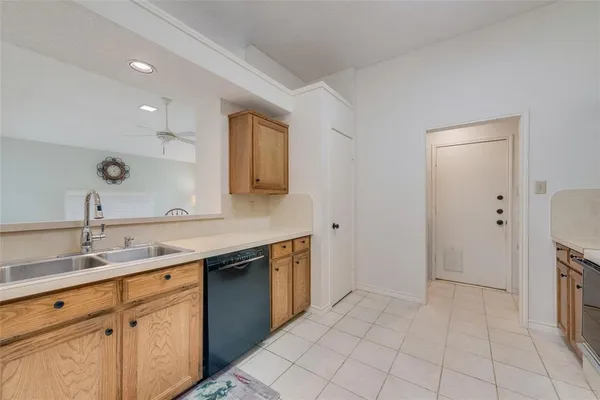 a spacious bathroom with a sink and a mirror