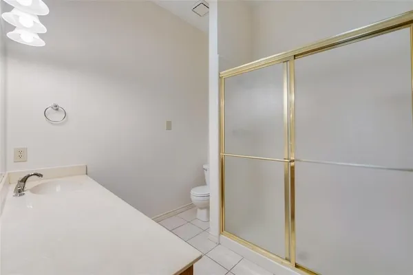 a bathroom with a sink and toilet