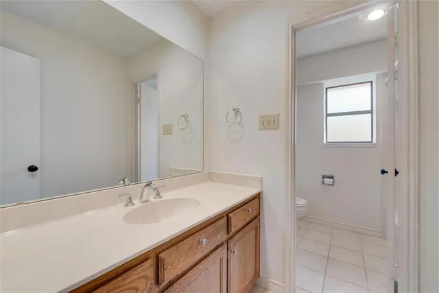 a bathroom with a sink double vanity and a mirror