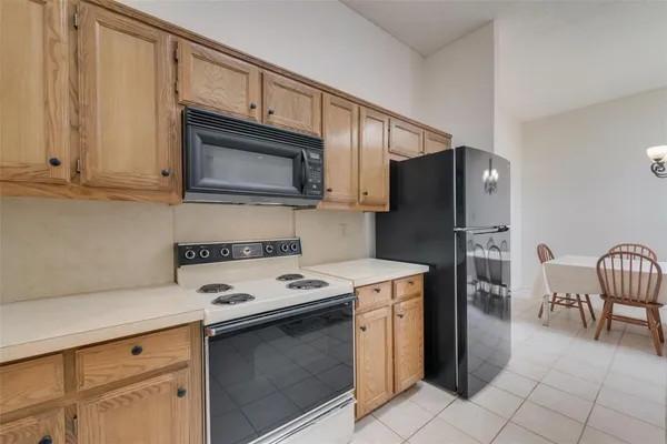 a kitchen with a stove microwave and refrigerator