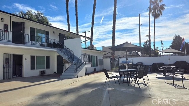 1803 West Sumac Lane, Unit 5 Anaheim, CA 92804 - Photo 14 of 18 a patio with a table and chairs