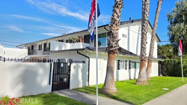 1803 West Sumac Lane, Unit 5 Anaheim, CA 92804 - Photo 2 of 18 a front view of a house with a yard
