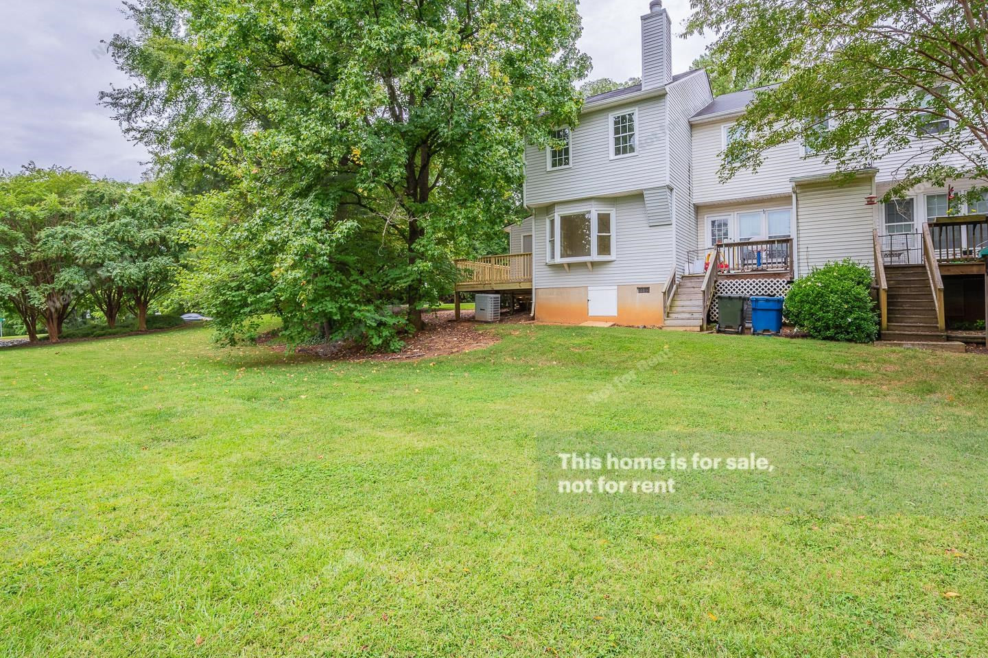16 Quintin Place Durham, NC 27705 - Photo 8 of 19 a view of a house with a yard and a tree