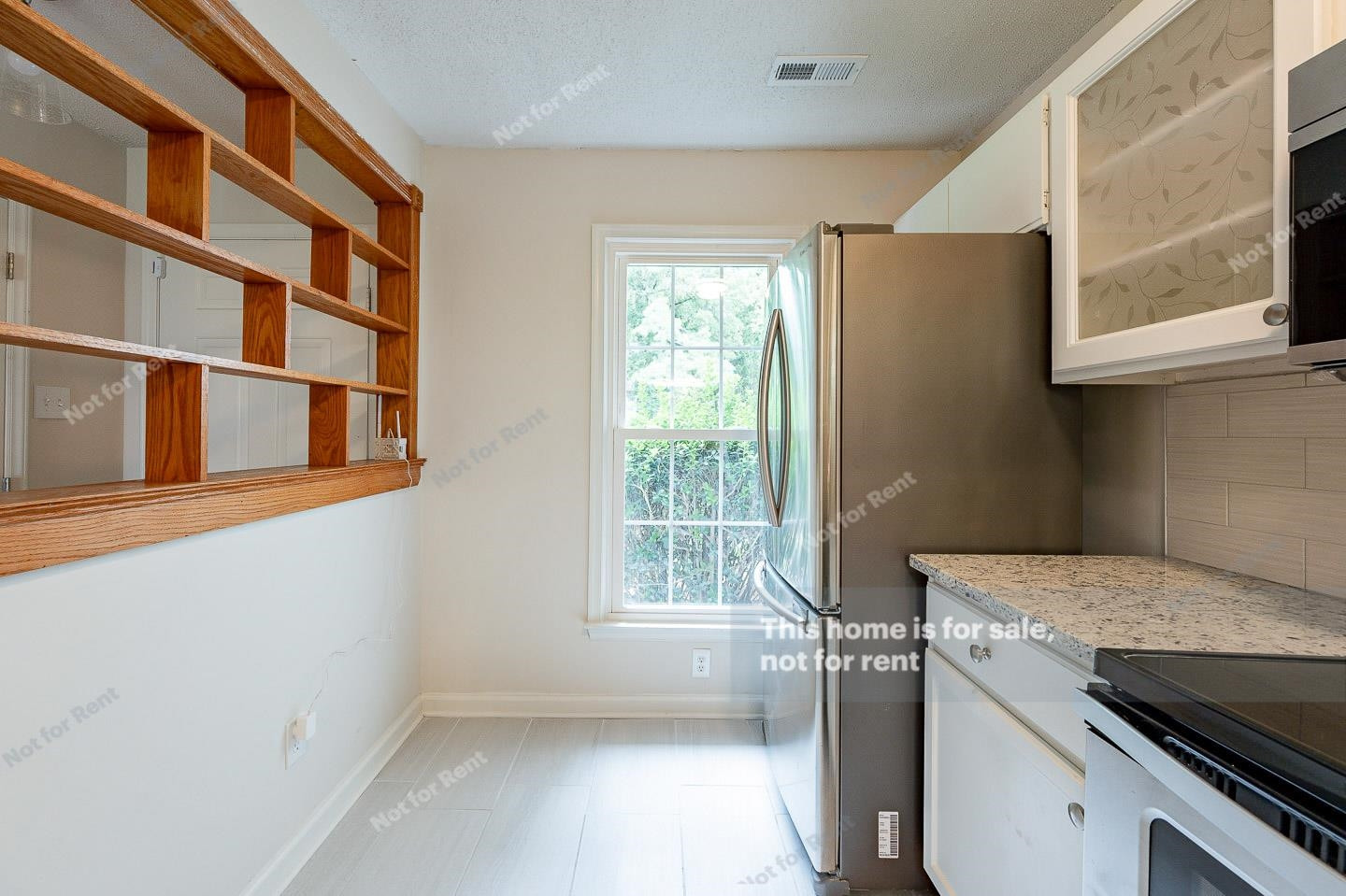 16 Quintin Place Durham, NC 27705 - Photo 9 of 19 a kitchen that has a cabinets and a stove