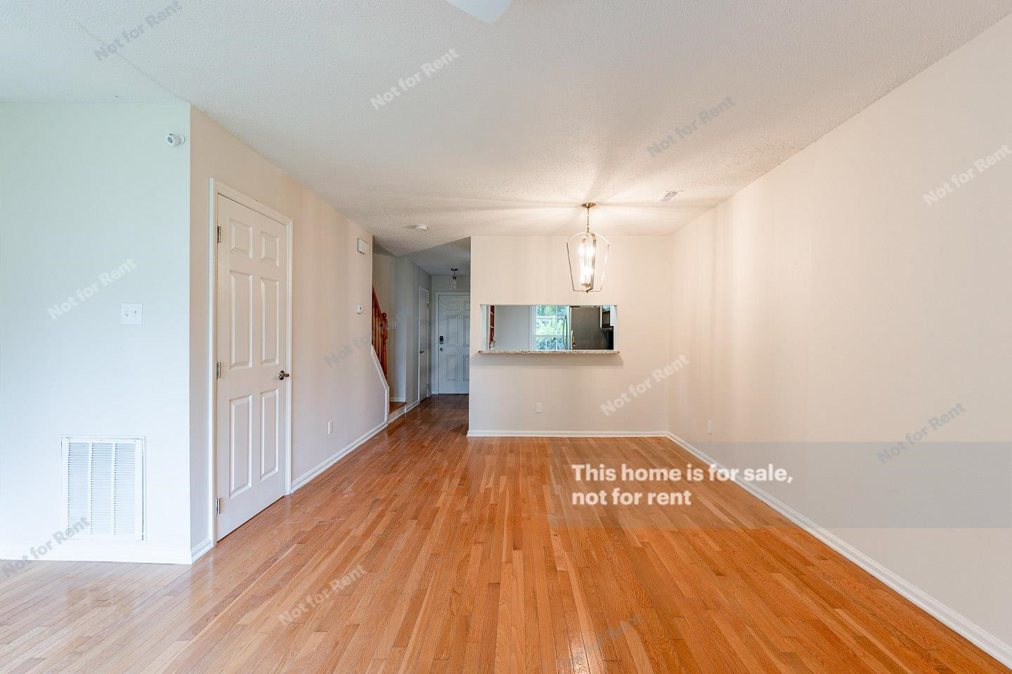 16 Quintin Place Durham, NC 27705 - Photo 10 of 19 a view of a room with wooden floor and staircase