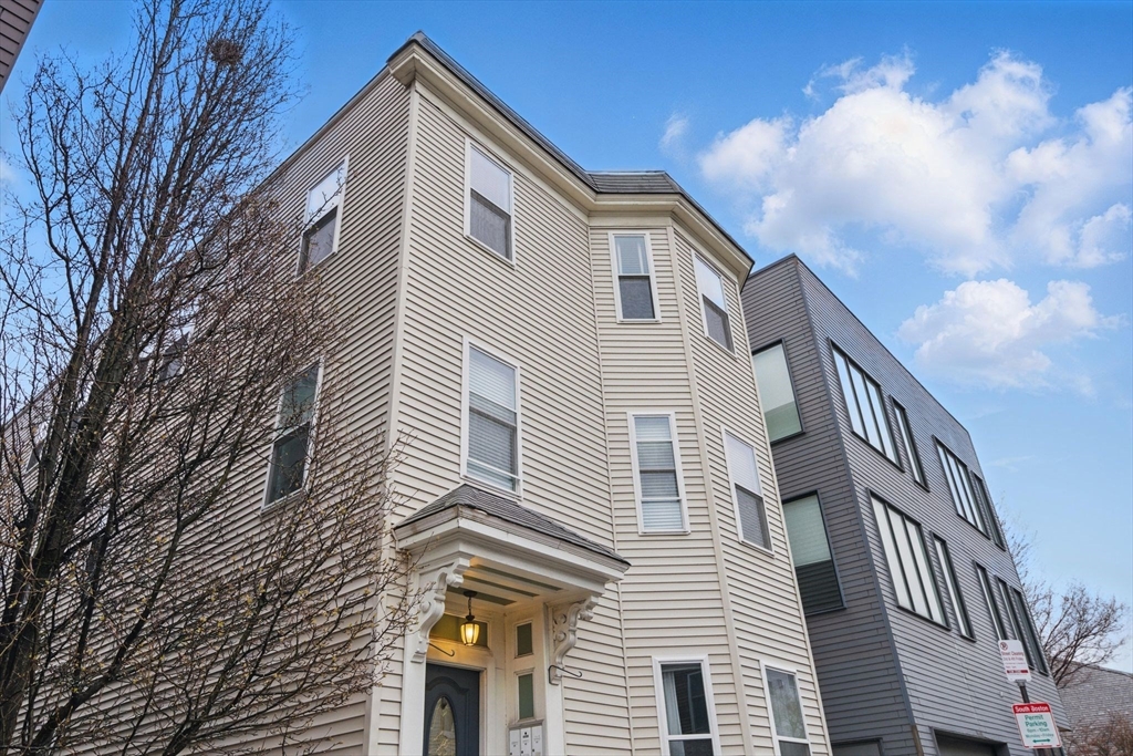 12 I Street, Unit 3 Boston, MA 02127 - Photo 17 of 19 a view of a house with a yard