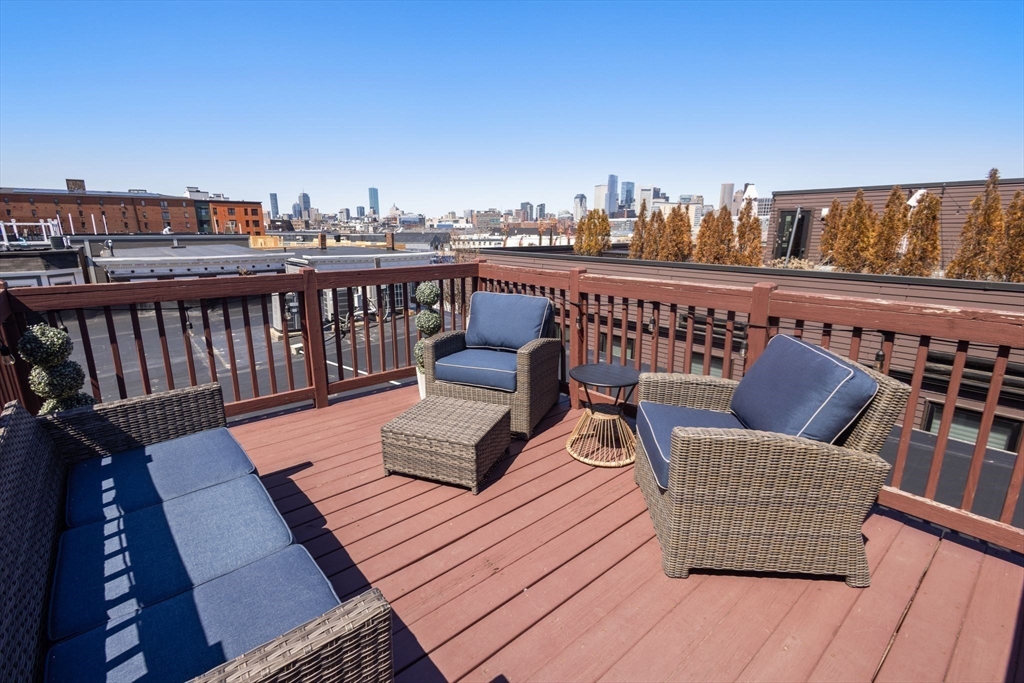 12 I Street, Unit 3 Boston, MA 02127 - Photo 2 of 19 a view of a balcony with wooden floor