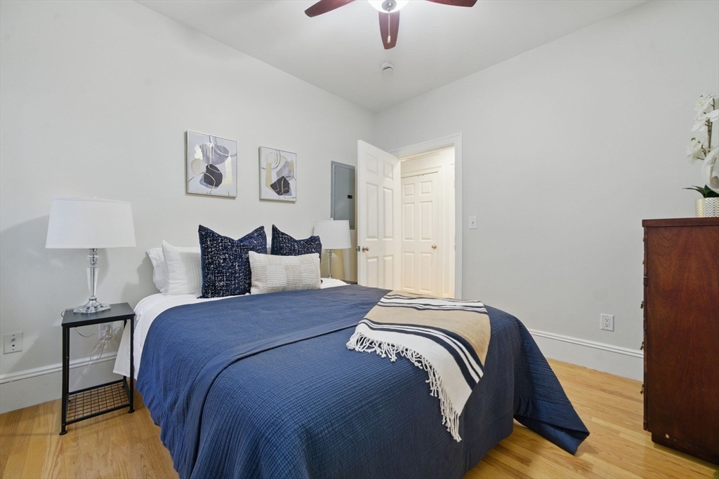 12 I Street, Unit 3 Boston, MA 02127 - Photo 7 of 19 a bedroom with bed and a night stand