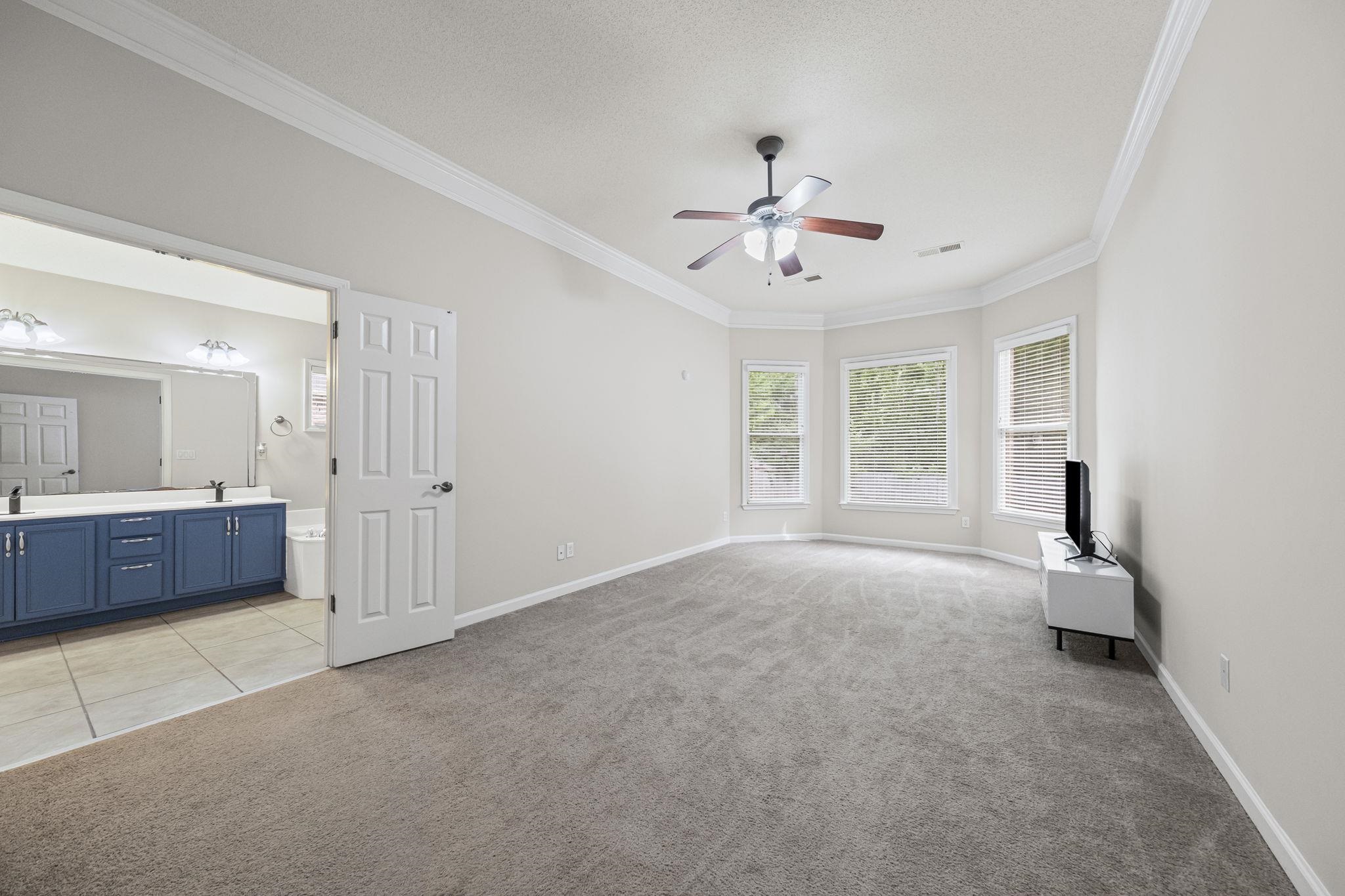 10467 Juneau Way Collierville, TN 38017 - Photo 17 of 34 a view of a room with a stylish ceiling fan and window