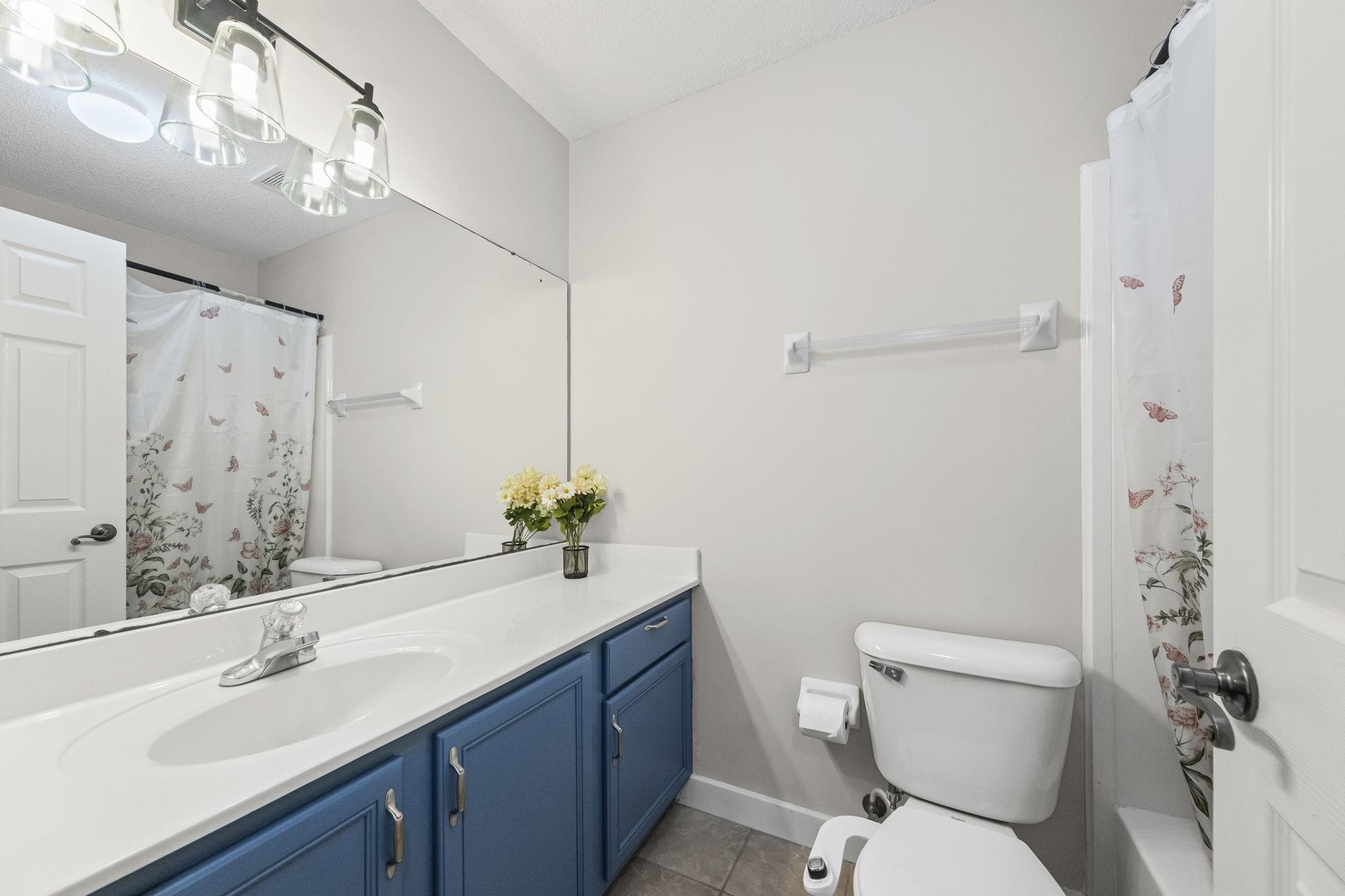 10467 Juneau Way Collierville, TN 38017 - Photo 23 of 34 a bathroom with a sink toilet and shower