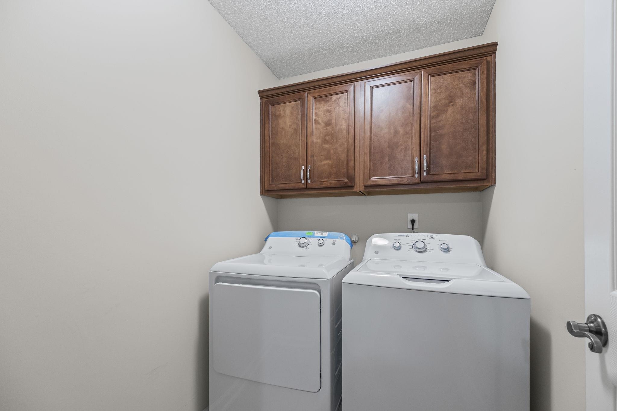 10467 Juneau Way Collierville, TN 38017 - Photo 26 of 34 a utility room with dryer and washer