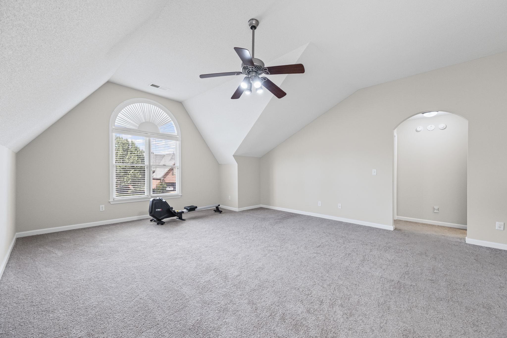 10467 Juneau Way Collierville, TN 38017 - Photo 27 of 34 an empty room with windows and fan