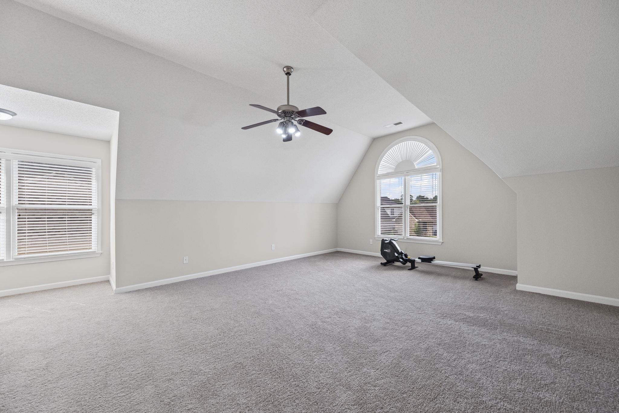 10467 Juneau Way Collierville, TN 38017 - Photo 28 of 34 an empty room with windows and fan