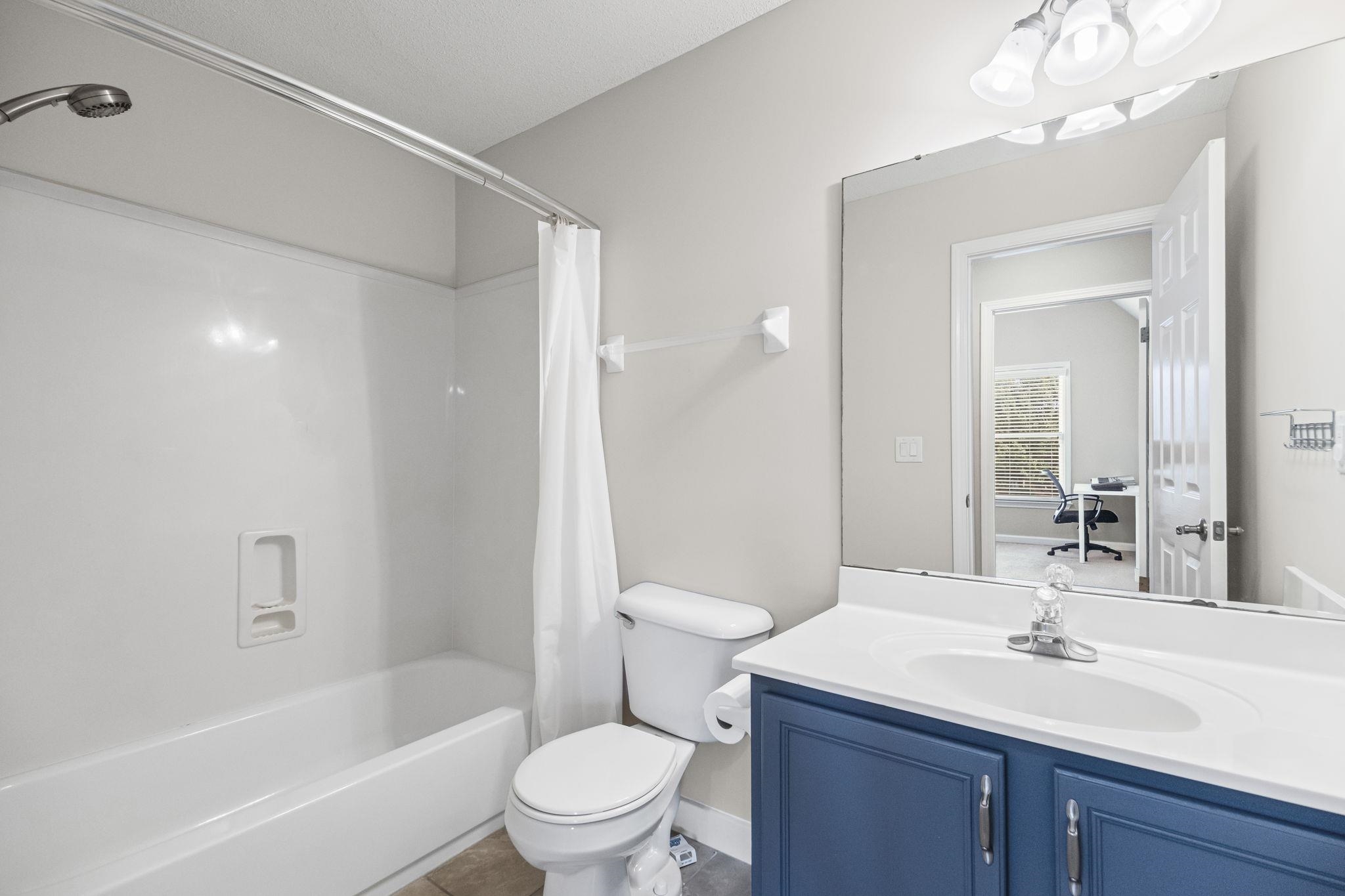 10467 Juneau Way Collierville, TN 38017 - Photo 29 of 34 a bathroom with a sink a toilet and shower