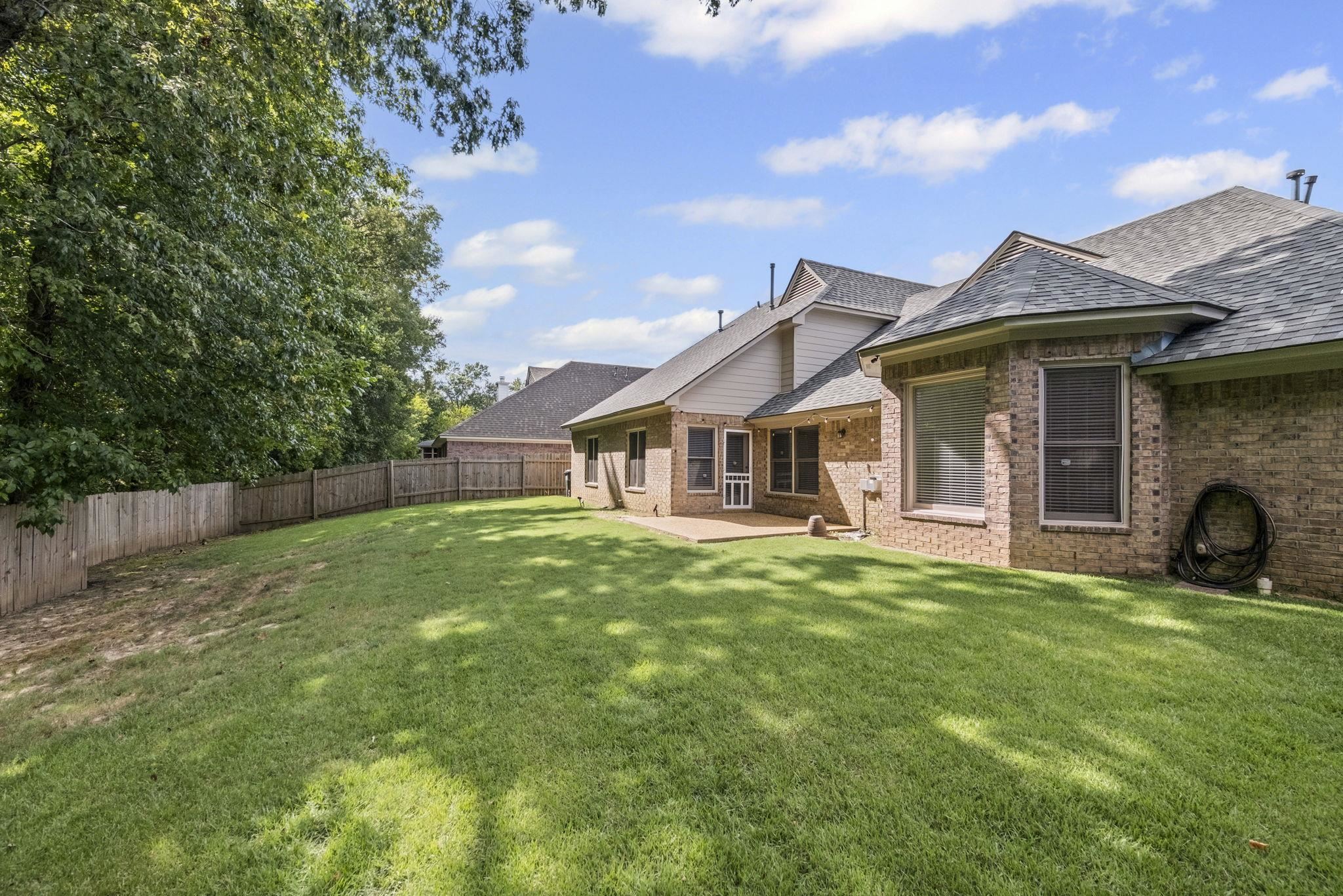 10467 Juneau Way Collierville, TN 38017 - Photo 32 of 34 a view of a house with a yard and sitting area