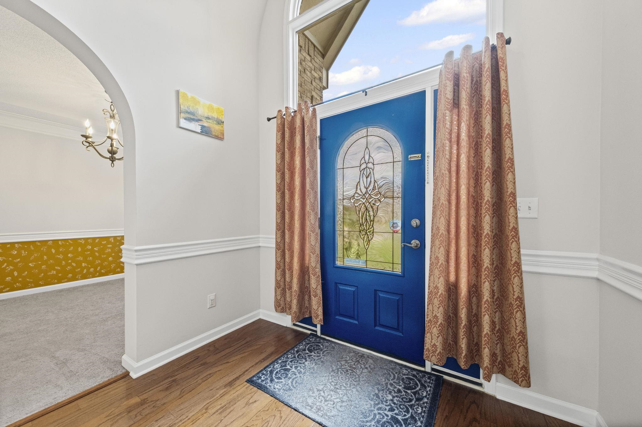 10467 Juneau Way Collierville, TN 38017 - Photo 4 of 34 a view of front door with wooden floor