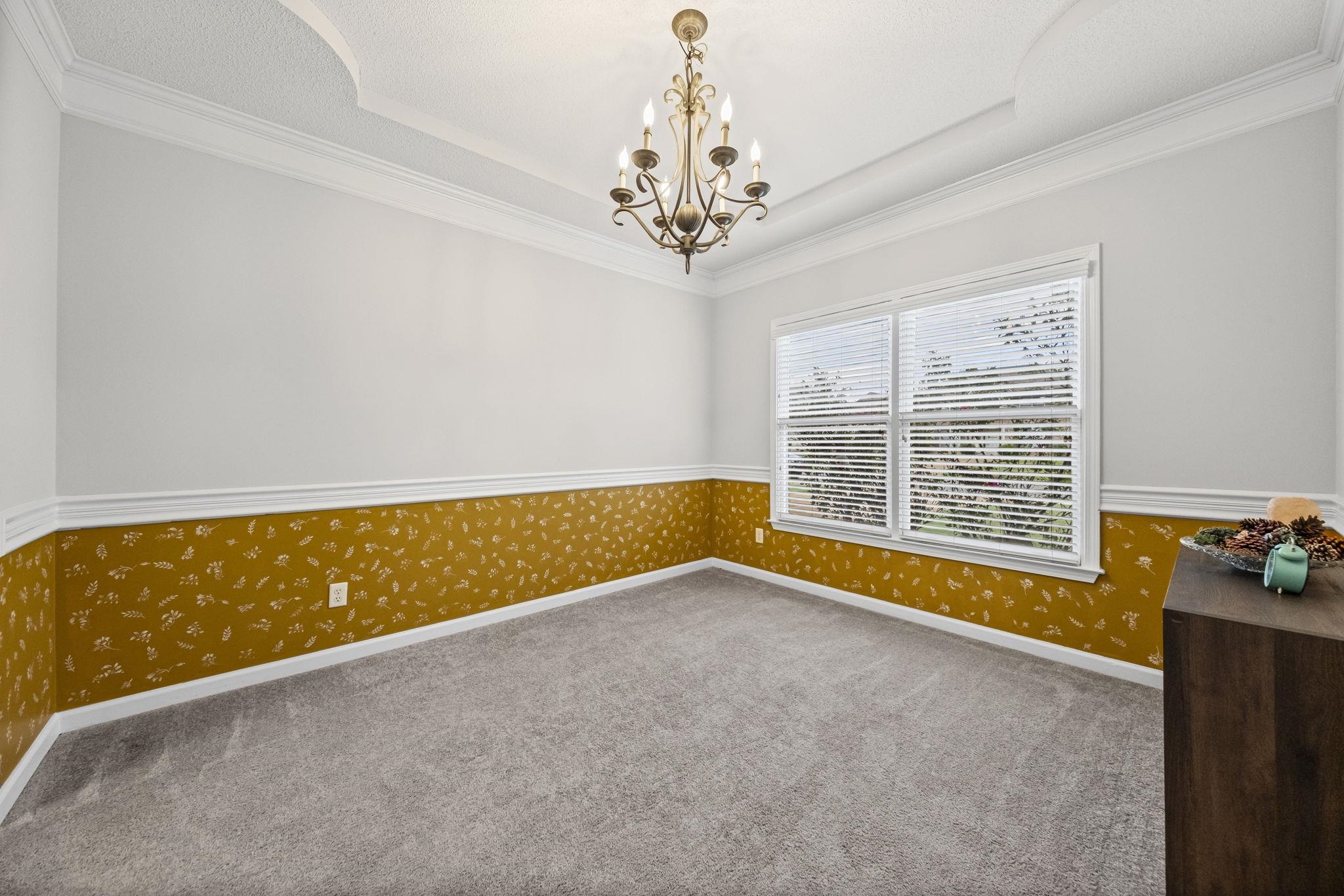 10467 Juneau Way Collierville, TN 38017 - Photo 6 of 34 a view of room with window and chandelier