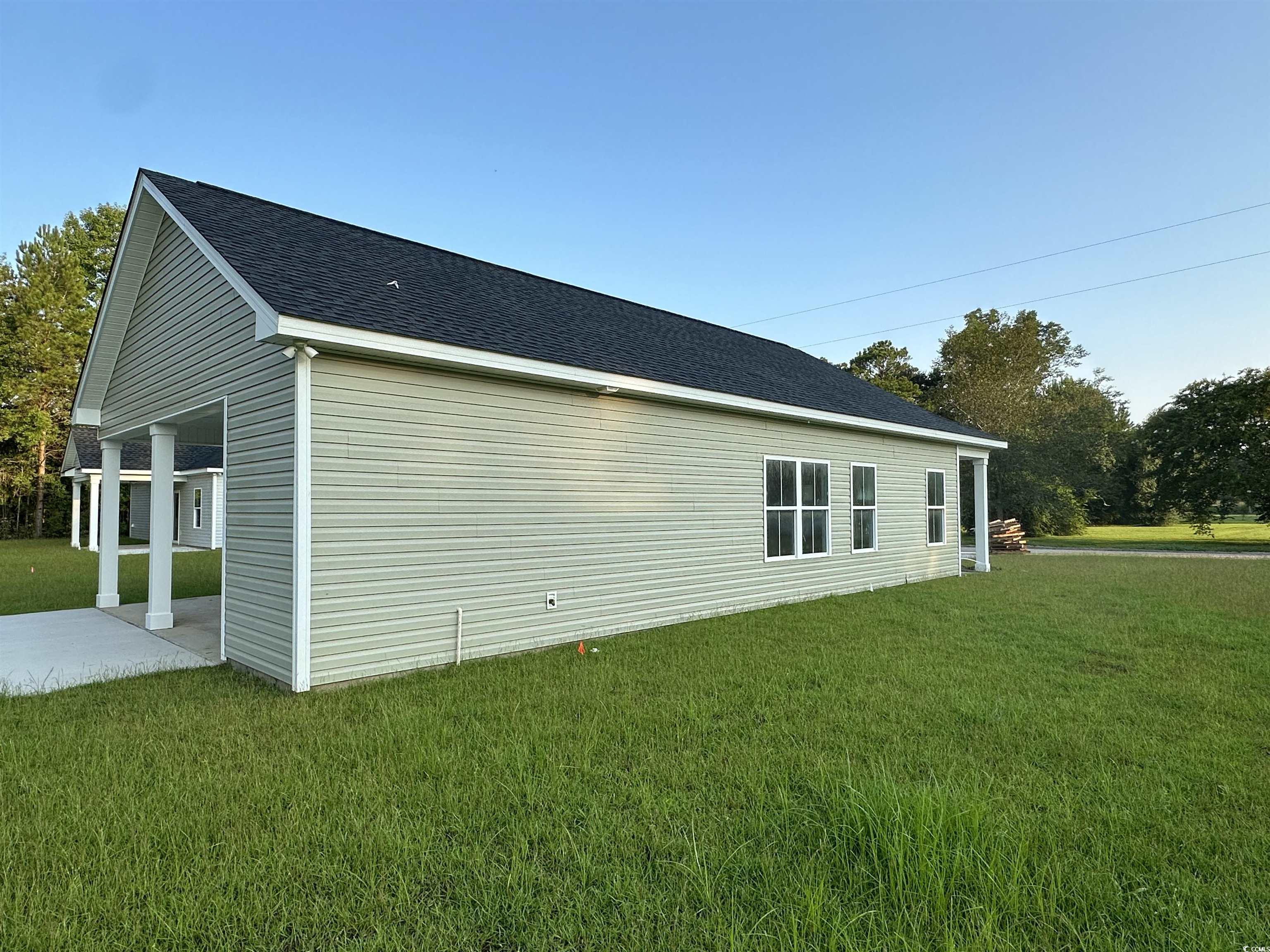 3474 Alton Road Loris, SC 29569 - Photo 15 of 16 View of property exterior featuring cooling unit a