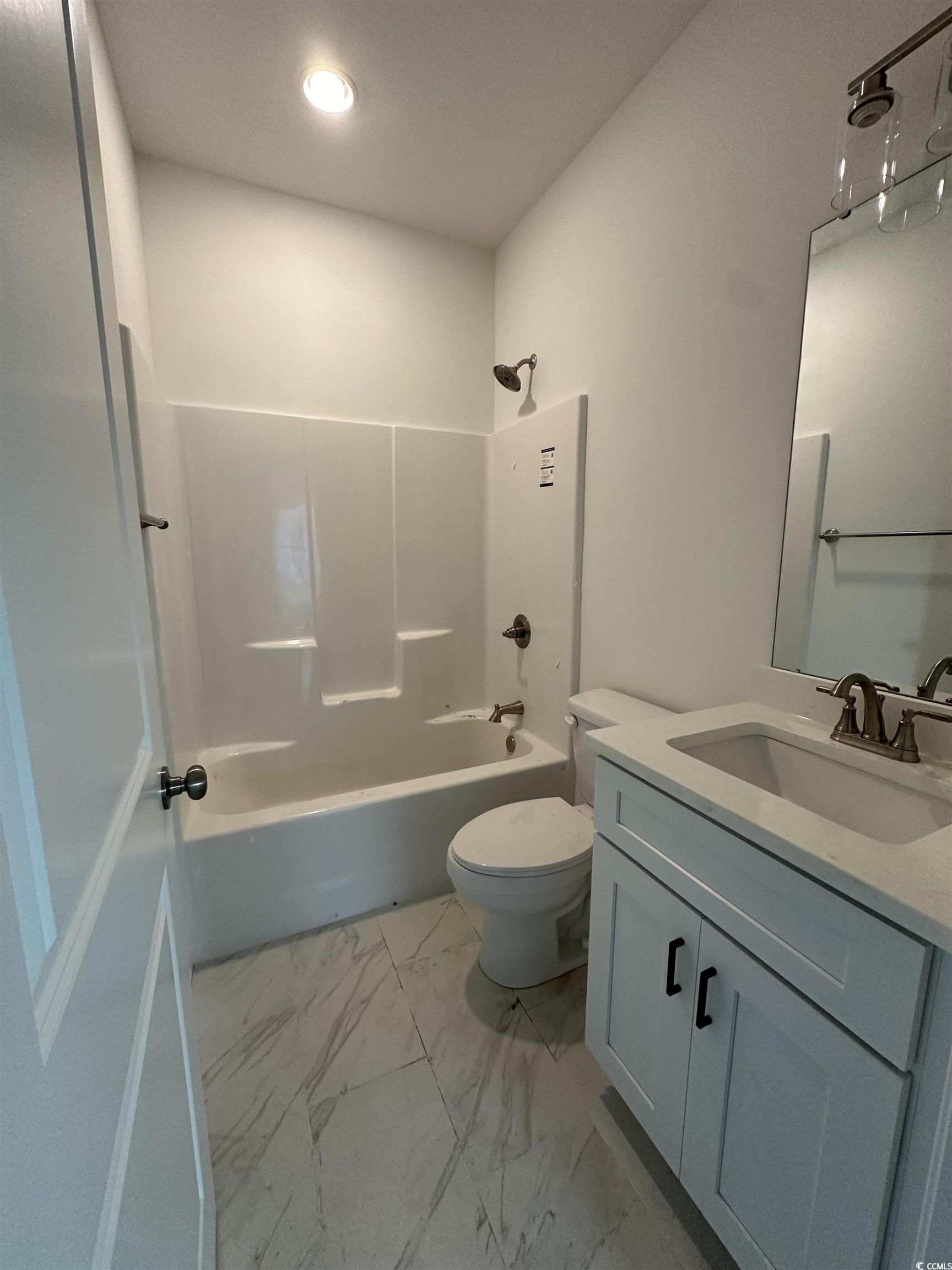 Full bathroom with tile patterned flooring,  showe