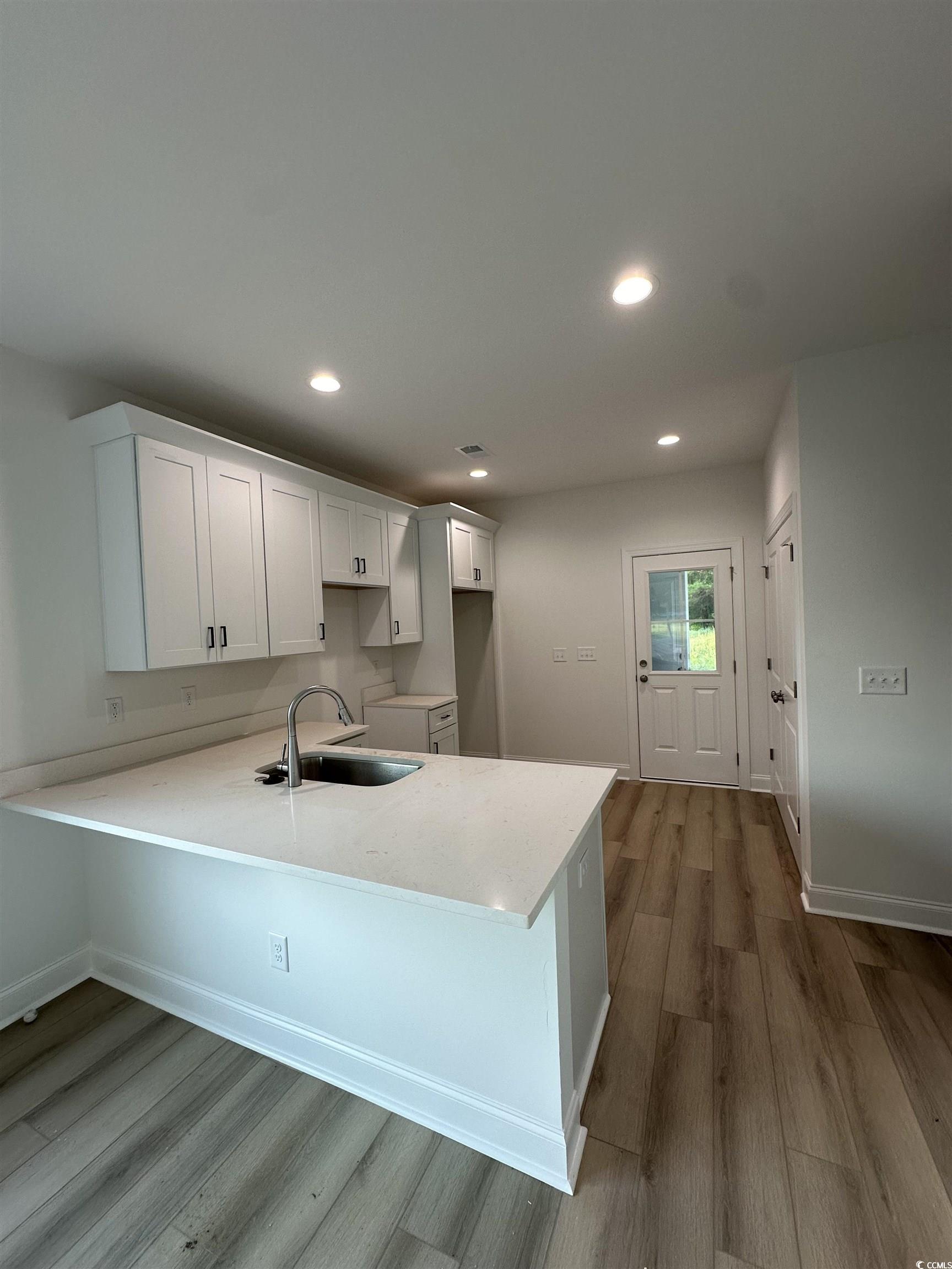 3474 Alton Road Loris, SC 29569 - Photo 8 of 16 Kitchen featuring sink, light stone counters, kitc