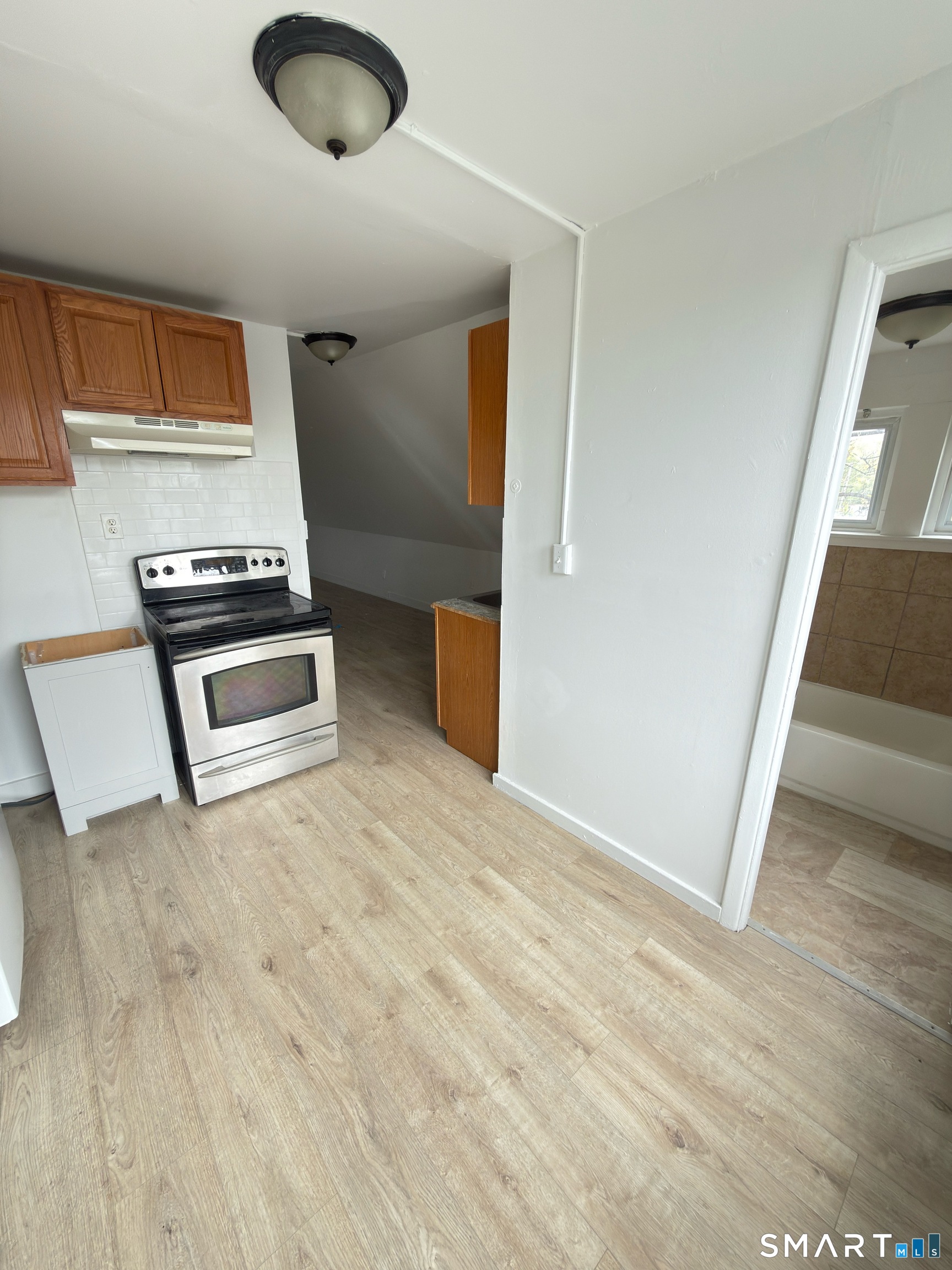 10 Beatrice Street, Unit 3 Bridgeport, CT 06607 - Photo 1 of 6 a view of kitchen and microwave
