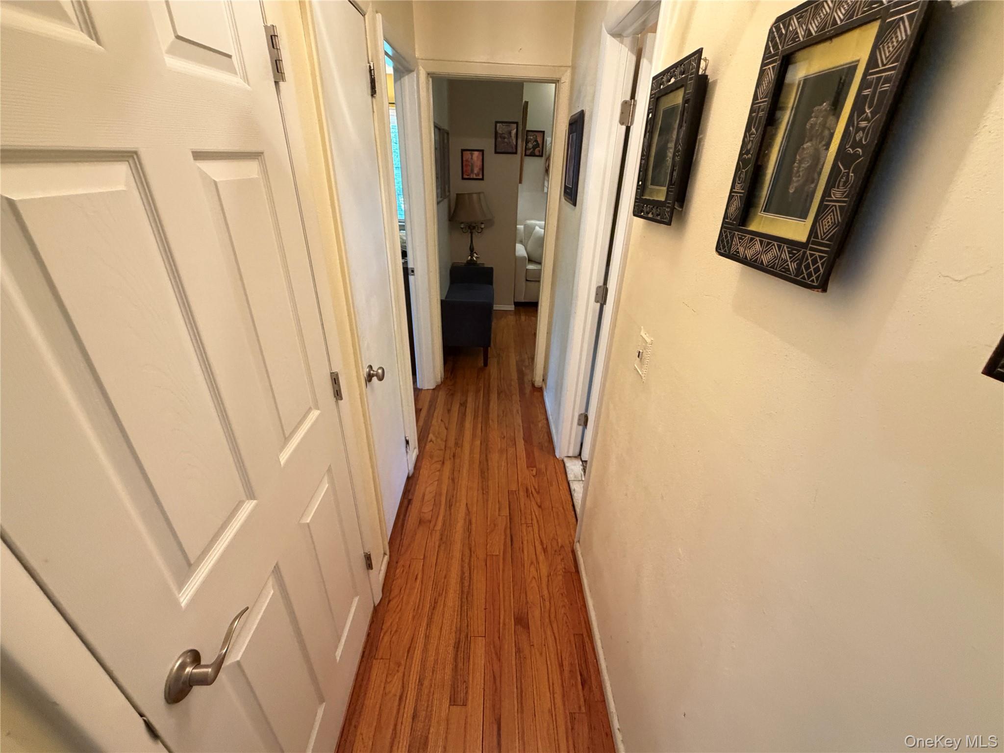 17 Mallory Road Spring Valley, NY 10977 - Photo 12 of 26 a view of a hallway with wooden floor and staircase