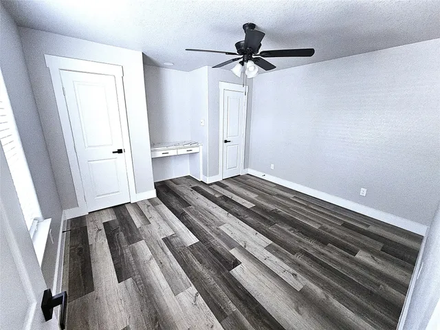 a bedroom with a bed and a rug