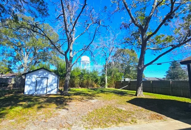 a house view with a backyard space
