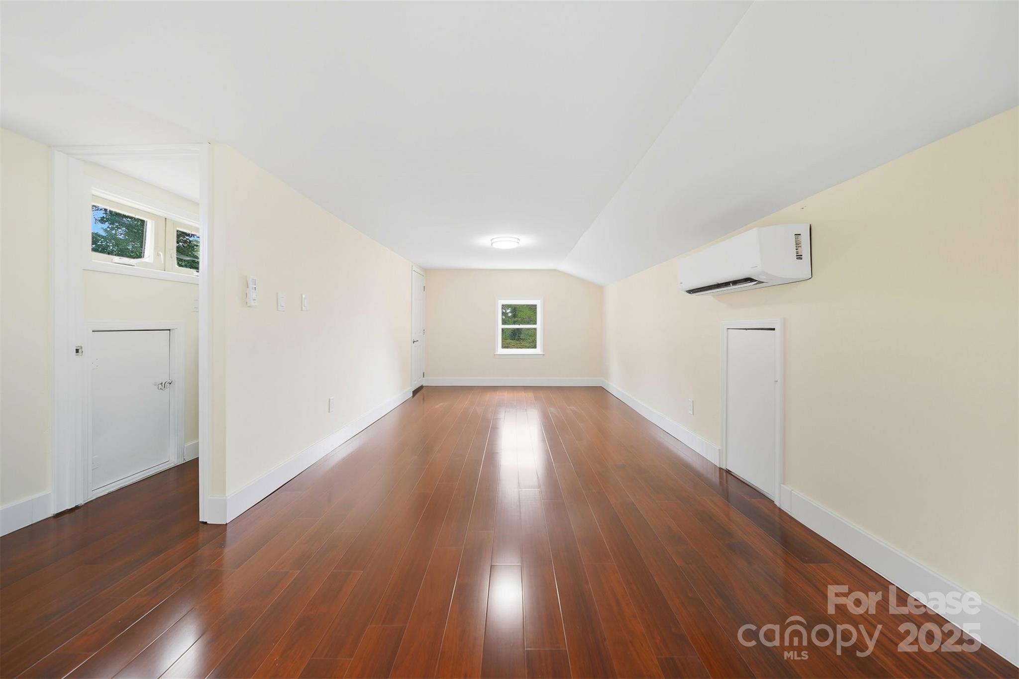 1234 11th Street Northwest Hickory, NC 28601 - Photo 13 of 19 an empty room with wooden floor and windows