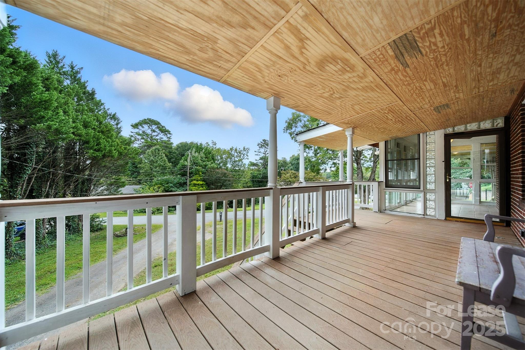 1234 11th Street Northwest Hickory, NC 28601 - Photo 16 of 19 a view of balcony with wooden floor and fence