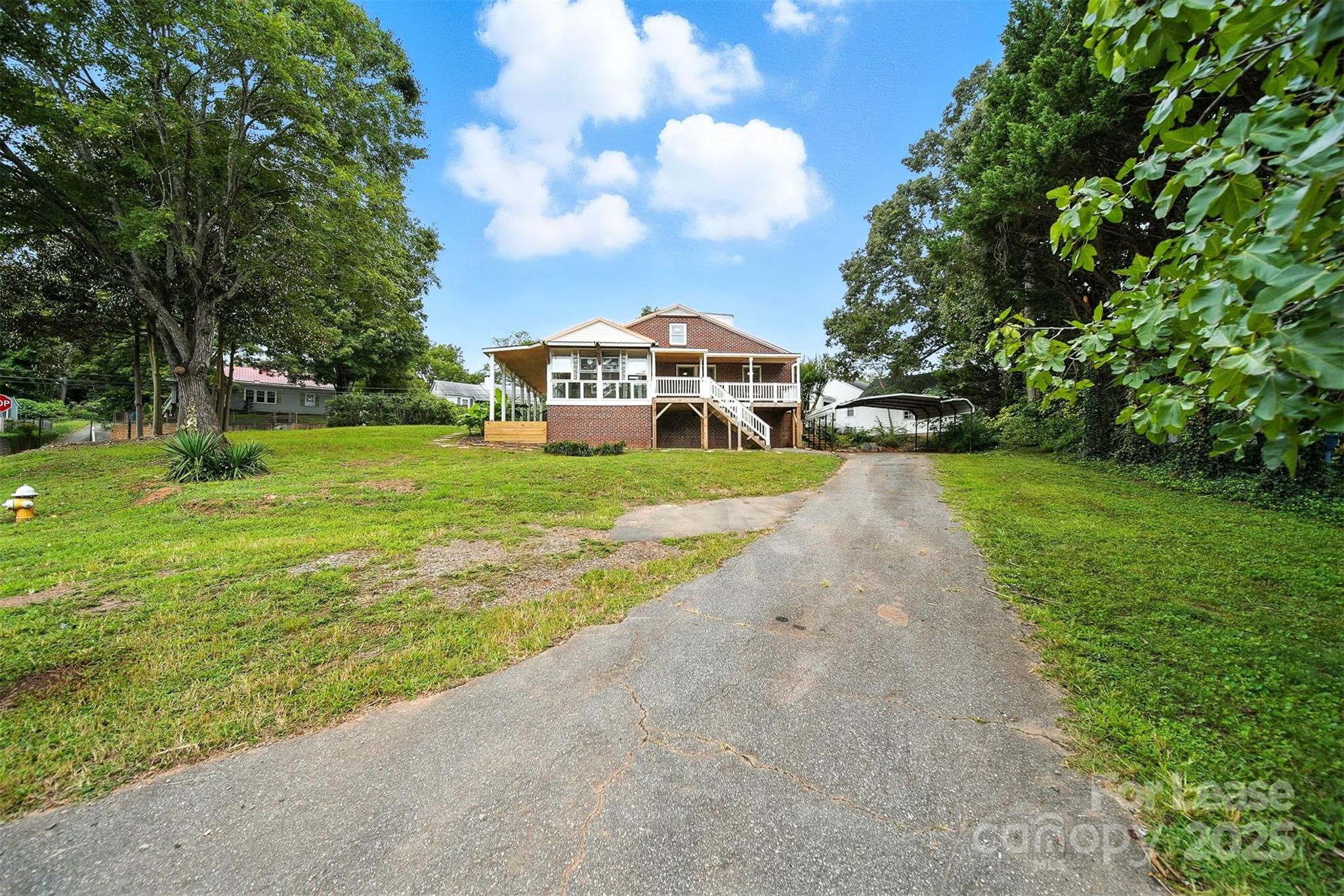 1234 11th Street Northwest Hickory, NC 28601 - Photo 19 of 19 a view of a town with large trees and a big yard