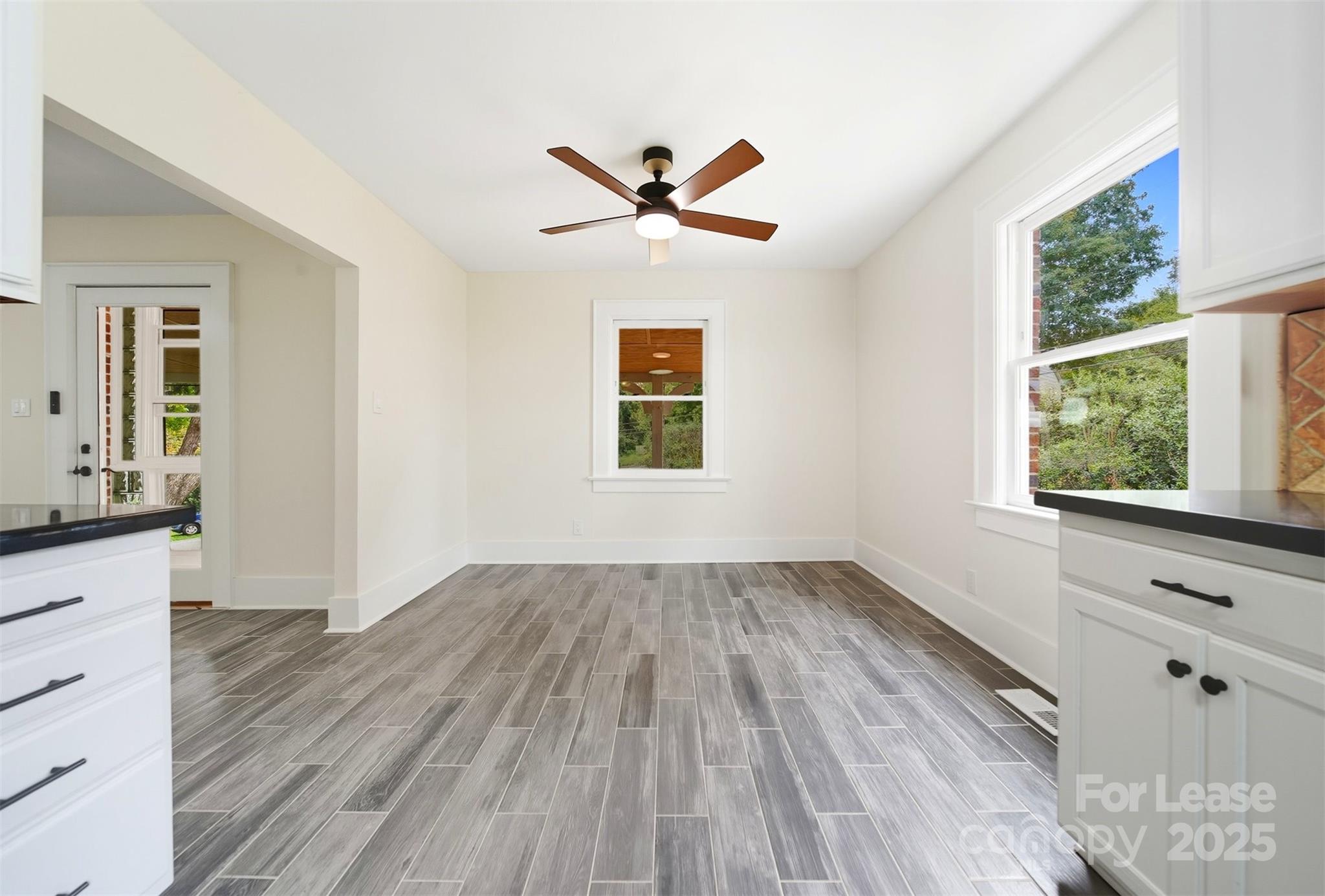 1234 11th Street Northwest Hickory, NC 28601 - Photo 5 of 19 wooden floor in an empty room with a window