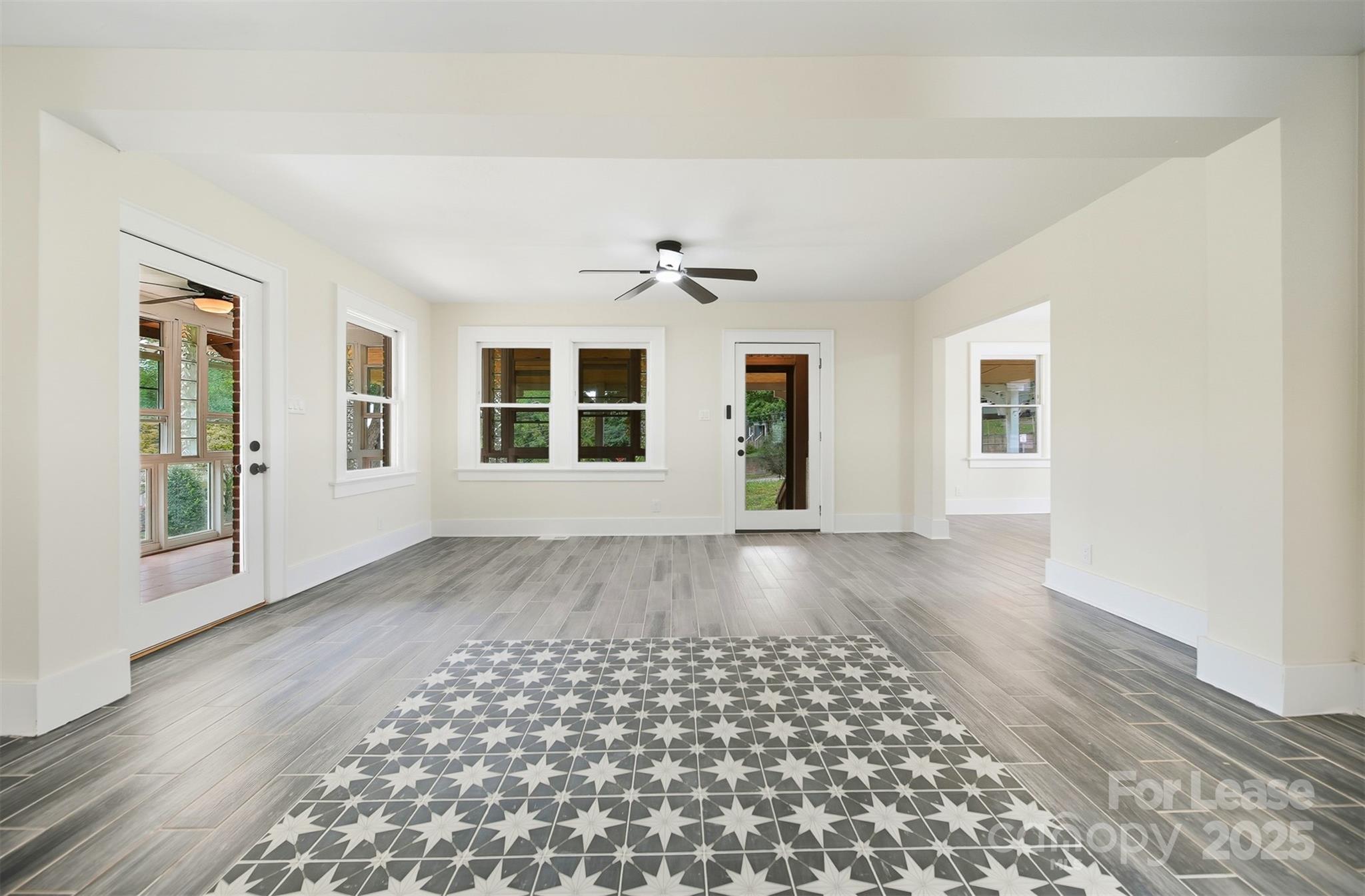 1234 11th Street Northwest Hickory, NC 28601 - Photo 6 of 19 a view of an empty room with a window and wooden floor