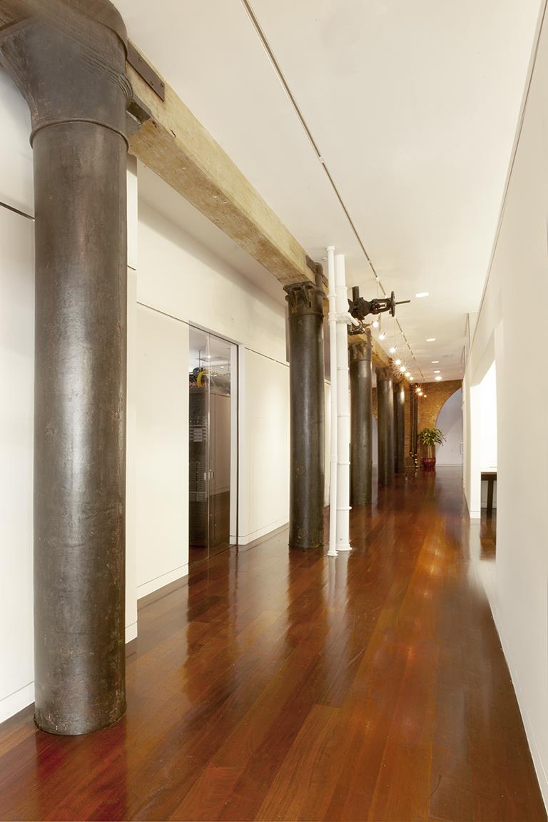169 Hudson Street, Unit 1D Manhattan, NY 10013 - Photo 3 of 12 a view of a hallway with wooden floor