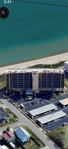 a view of backyard with seating space