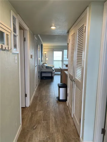 a view of a living room with a wooden floor
