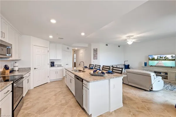 a kitchen with stove and cabinets