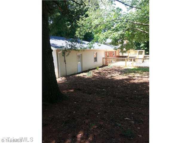 102 Westridge Drive King, NC 27021 - Photo 2 of 11 Exterior Back. Back view with large deck leading to pool.