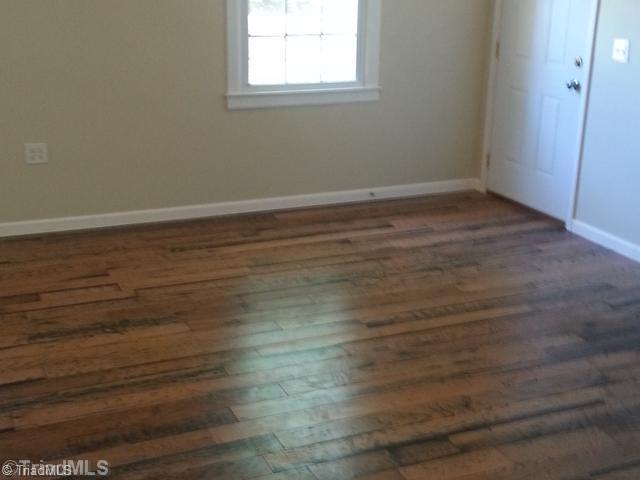 102 Westridge Drive King, NC 27021 - Photo 6 of 11 Den/Family/Great Room. Large den with wood floors.