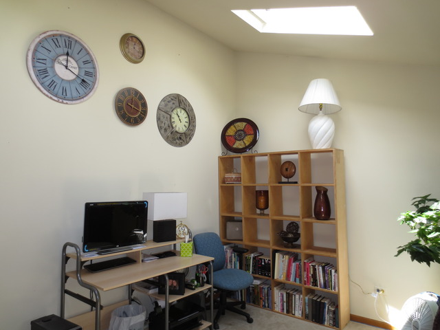 14820 South Penn Road Plainfield, IL 60544 - Photo 11 of 25 a view of a workspace with a bookshelf