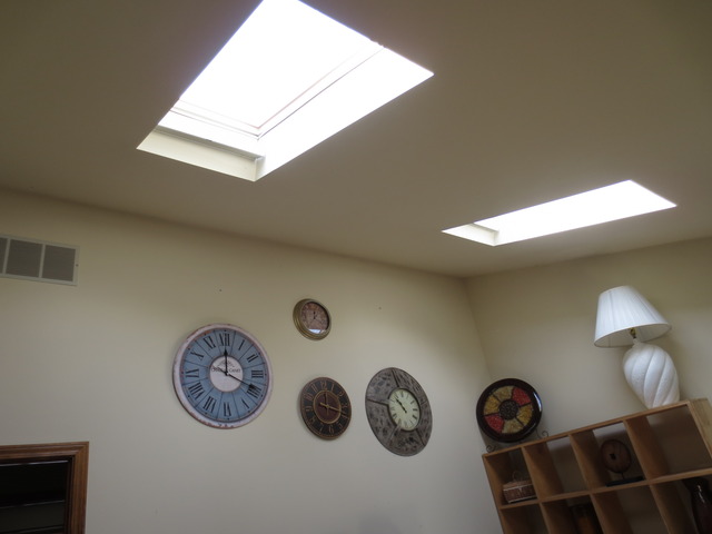 14820 South Penn Road Plainfield, IL 60544 - Photo 12 of 25 a view of a hallway with a clock on the wall and a large mirror