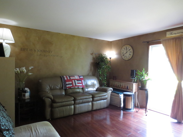 14820 South Penn Road Plainfield, IL 60544 - Photo 3 of 25 a living room with furniture and a wooden floor