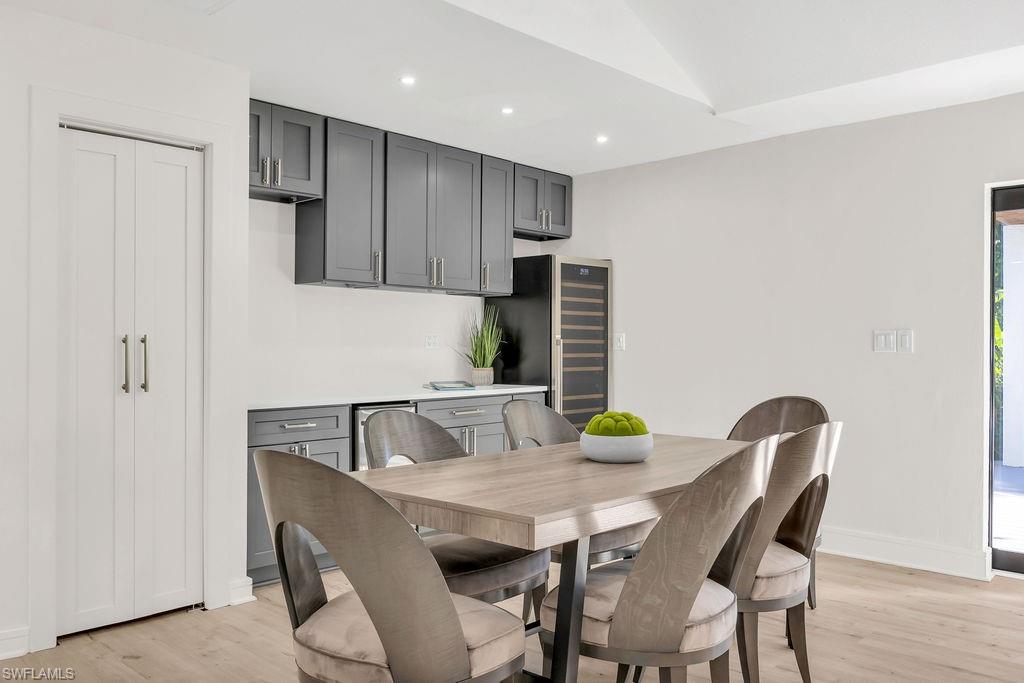 3155 64th Street Southwest Naples, FL 34105 - Photo 11 of 45 a view of a dining room with furniture