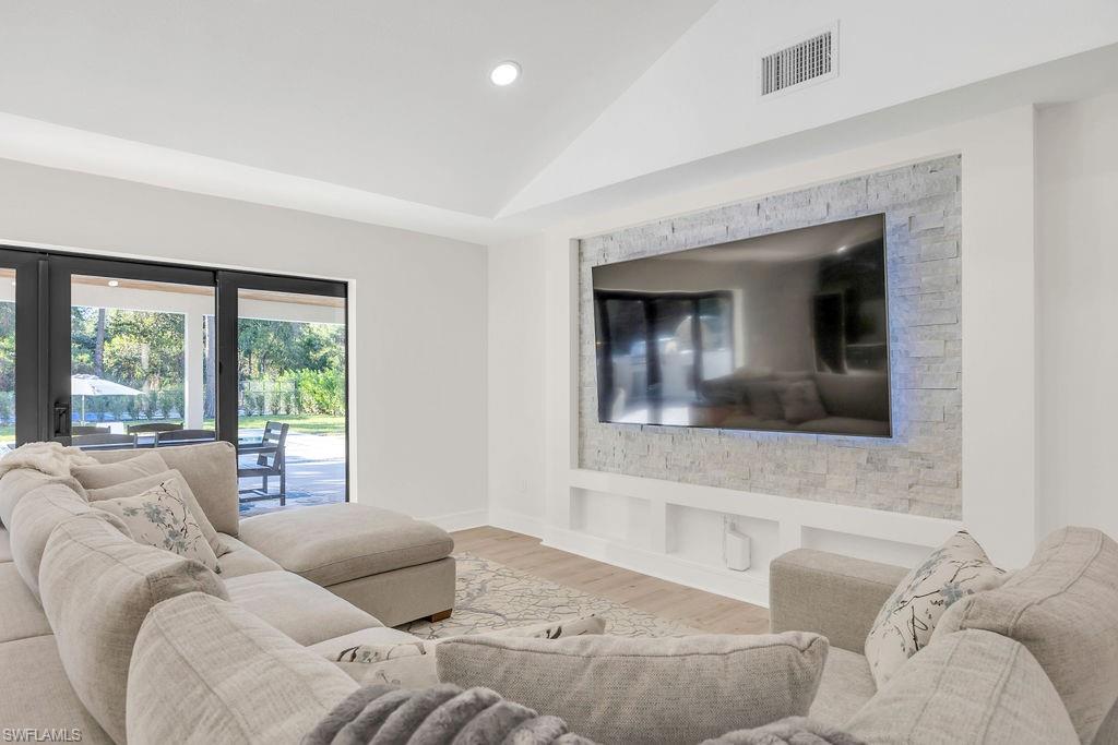 3155 64th Street Southwest Naples, FL 34105 - Photo 13 of 45 a living room with furniture and a large window