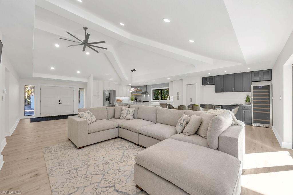 3155 64th Street Southwest Naples, FL 34105 - Photo 14 of 45 a living room with furniture and a ceiling fan
