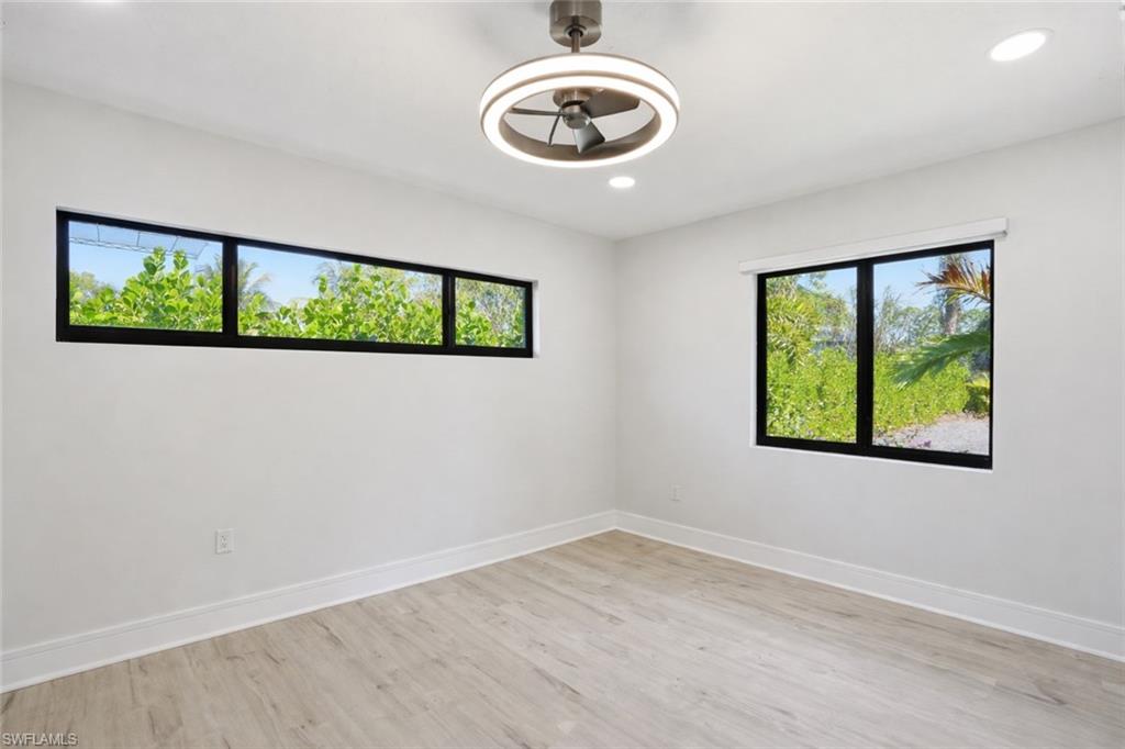 3155 64th Street Southwest Naples, FL 34105 - Photo 21 of 45 an empty room with windows