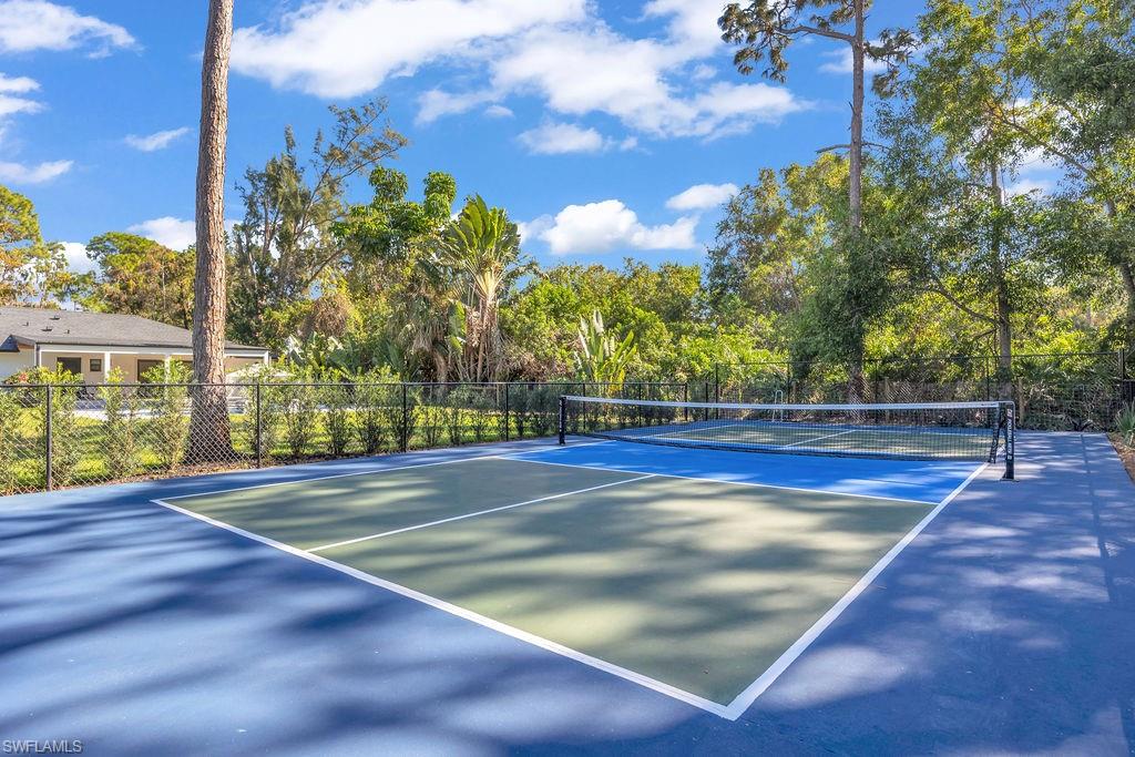 3155 64th Street Southwest Naples, FL 34105 - Photo 3 of 45 a view of an outdoor space and tennis court
