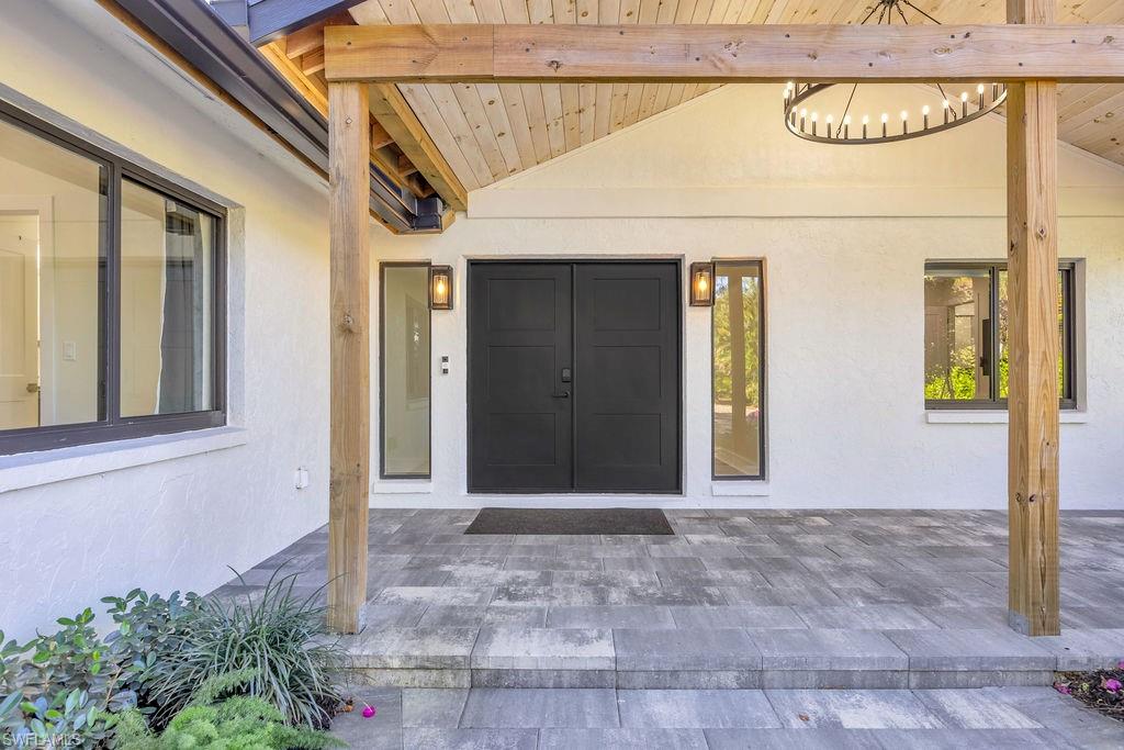 3155 64th Street Southwest Naples, FL 34105 - Photo 36 of 45 a front view of a house