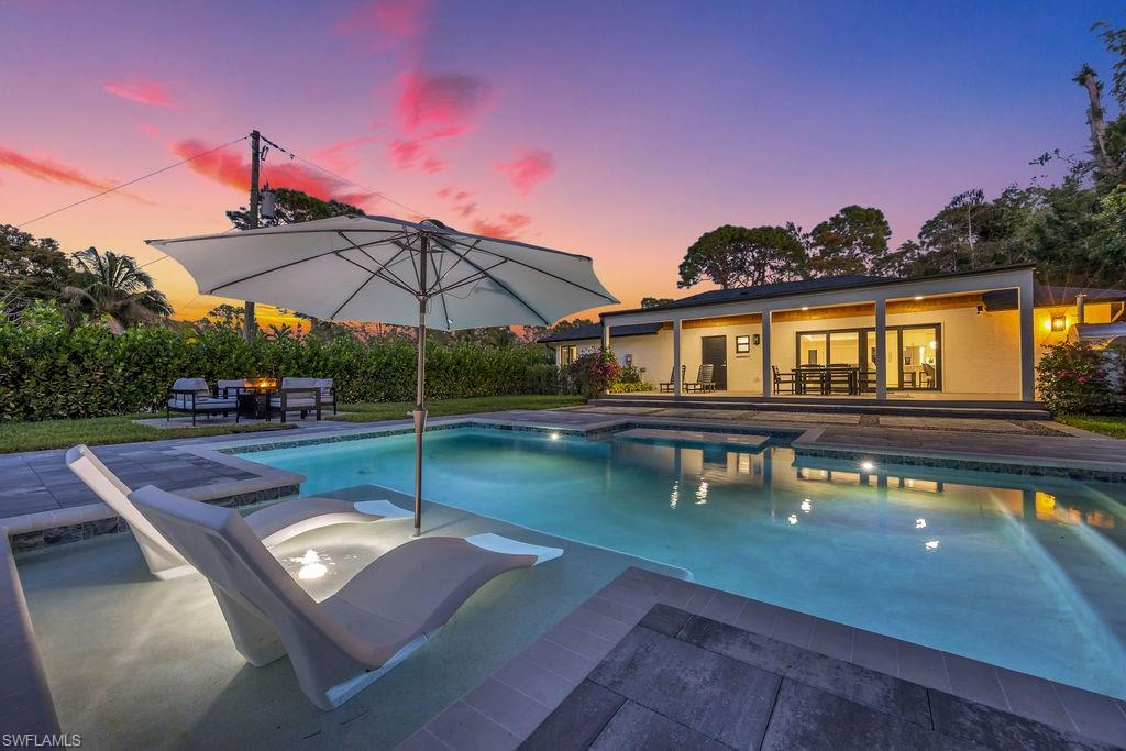 3155 64th Street Southwest Naples, FL 34105 - Photo 40 of 45 a view of a house with swimming pool and sitting area