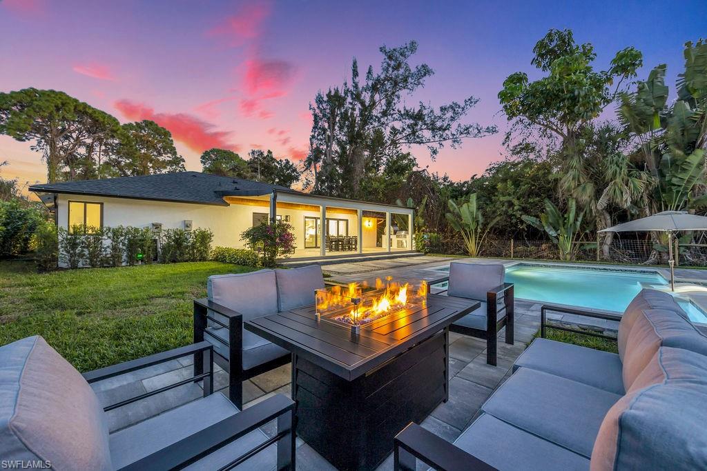 3155 64th Street Southwest Naples, FL 34105 - Photo 41 of 45 a view of a with furniture and a yard